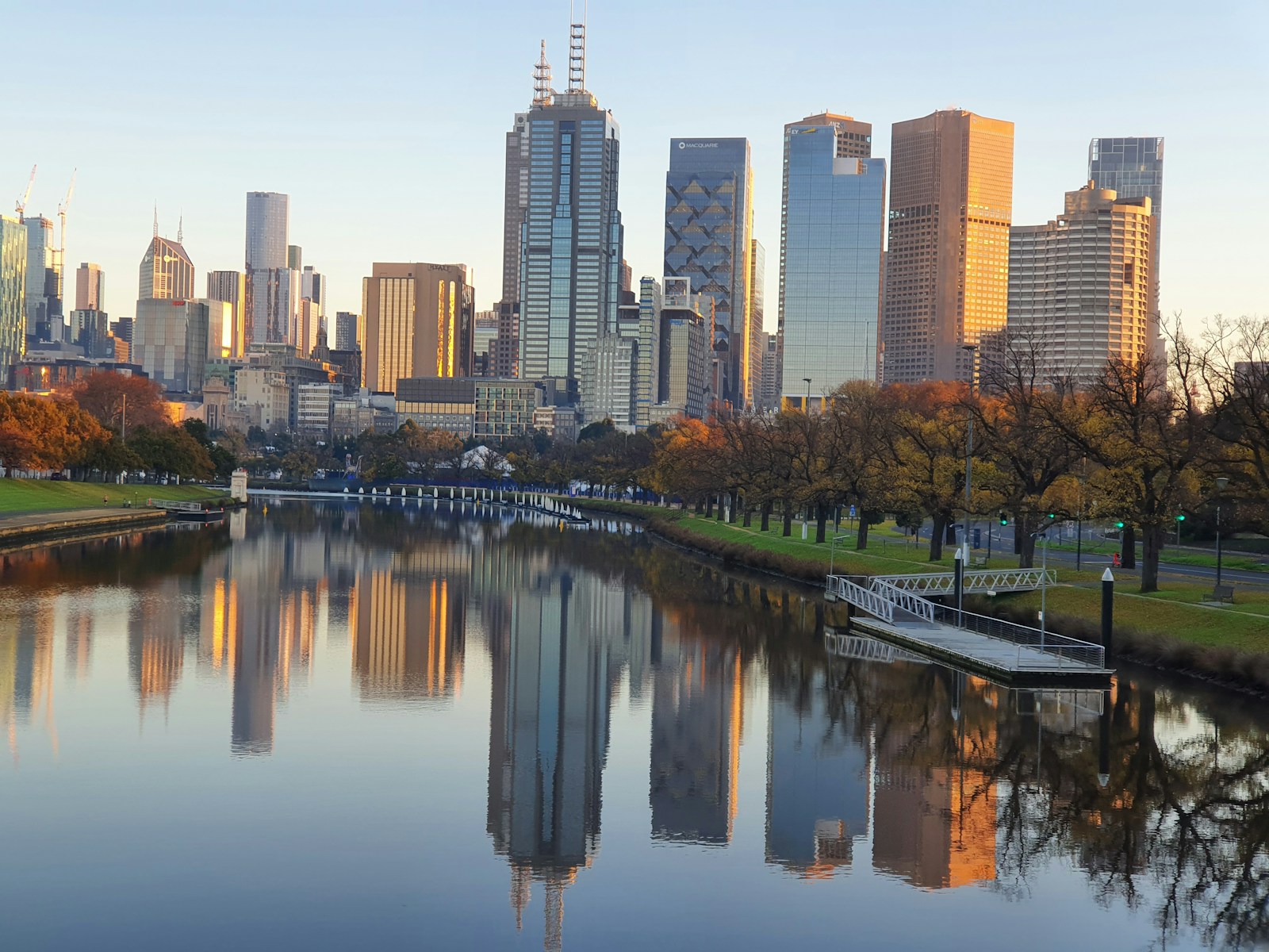 a body of water with a city in the background